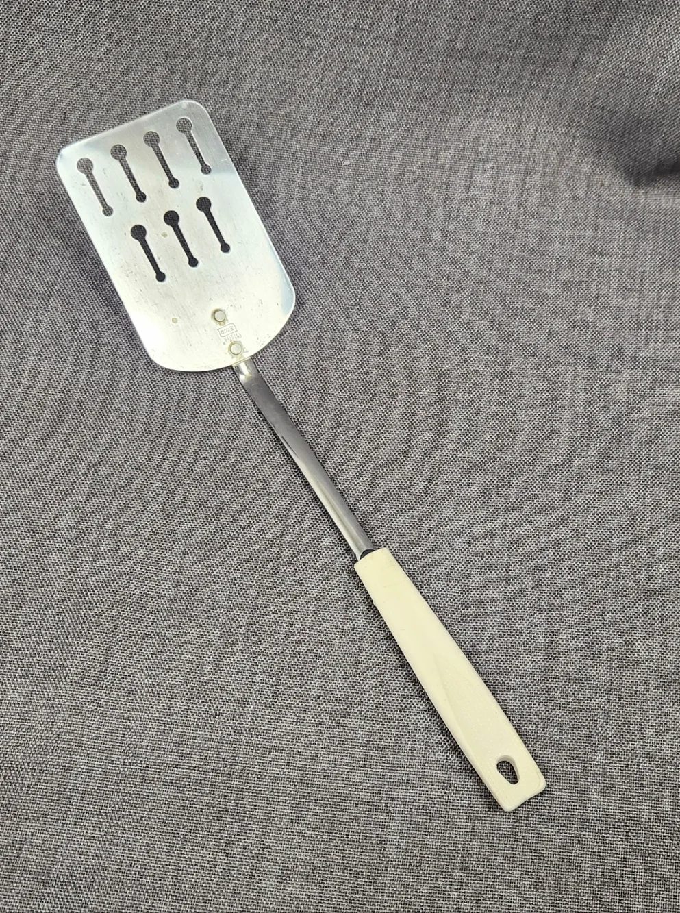 Vintage Ekco Stainless Steel Slotted Spatula White Handle.